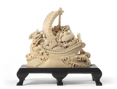 Lot 237 - A Japanese Ivory Takarubune Okimono, Meiji period, the laden treasure ship at full sail on...