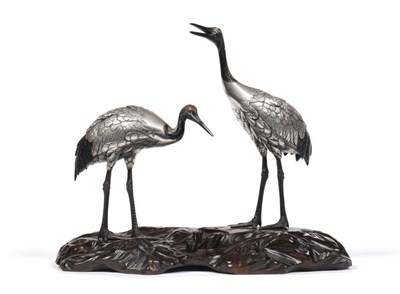Lot 244 - A Pair of Japanese Silvered and Enamelled Bronze Figures of Cranes, Meiji period, standing on a...