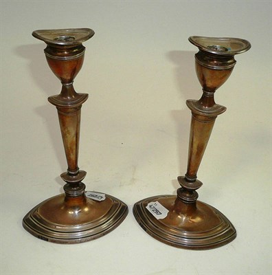 Lot 15 - A pair of silver hallmarked elliptical candlesticks