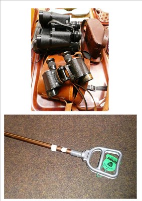 Lot 18 - Three pairs of binoculars in leather cases and a shooting stick