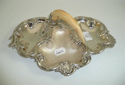 Lot 21 - An early 20th century silver plated three division dish with tusk handle