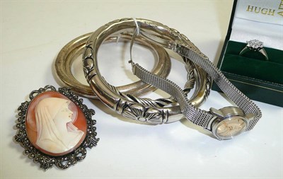 Lot 53 - Assorted silver bangles, a cluster ring, a cameo brooch and a lady's stainless steel Seamaster...