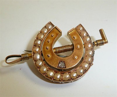 Lot 71 - A horseshoe and crop brooch set with an old cut diamond and half pearls