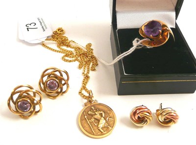 Lot 73 - An amethyst ring stamped '14k', a 9ct gold St Christopher pendant and two pairs of earrings