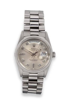 Lot 271 - A Fine Platinum Day/Date Automatic Centre Seconds Wristwatch with a Diamond Set Dial, signed Rolex