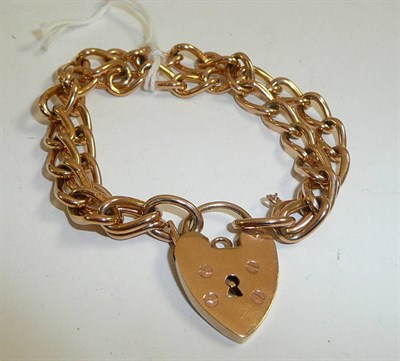 Lot 85 - A double curb and lock bracelet