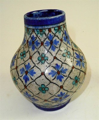 Lot 100 - A blue and floral decorated Doulton Lambeth vase