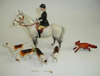 Lot 116 - Beswick Huntswoman on grey horse, model No. 1730, four Beswick fox hounds and a fox (all a/f)