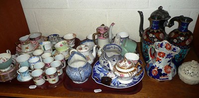 Lot 131 - Two shelves of decorative ceramics, pair of Cloisonne vases, Shelley jelly moulds, carnival...