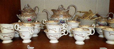 Lot 150 - An extensive 19th century floral decorated Rockingham style tea and dinner service