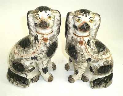 Lot 168 - A pair of Victorian Staffordshire King Charles Spaniels