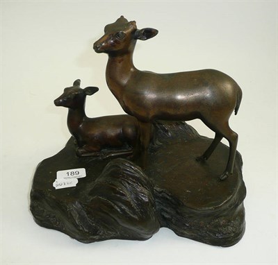 Lot 189 - A bronze figure group on a rocky base