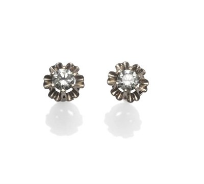 Lot 283 - A Pair of Diamond Solitaire Stud Earrings, the round brilliant cut diamonds in white stylised...