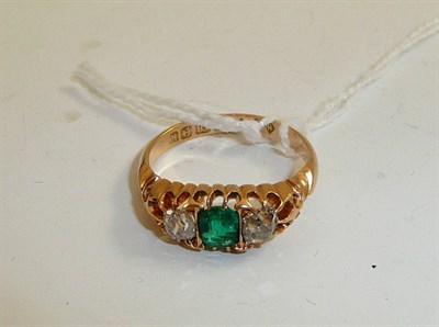 Lot 207 - An 18ct gold emerald and diamond three stone ring