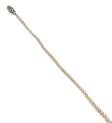 Lot 285 - A Pearl Necklace, ninety-eight graduated off-round pearls strung to a diamond set clasp, length...