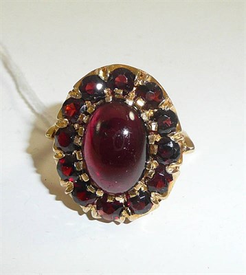 Lot 222 - A 9ct gold and garnet cluster ring, boxed