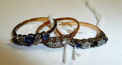 Lot 231 - A diamond three stone ring, a sapphire and diamond five stone ring and another (one stone missing)