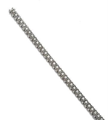 Lot 286 - A Diamond Line Bracelet, round brilliant cut diamonds held in white claws in articulated...