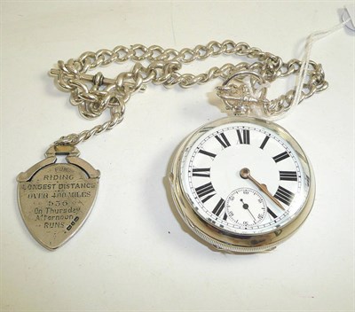 Lot 249 - A silver open faced pocket watch with a Birmingham hallmarked case, with a silver watch chain...