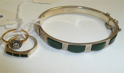 Lot 251 - A diamond mourning ring, shank stamped 18ct, a New Zealand bangle and ring (3)