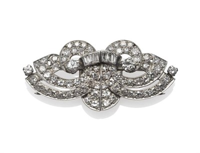 Lot 288 - An Art Deco Diamond Double Clip Brooch, set with brilliant cut, baguette cut, and eight-cut...