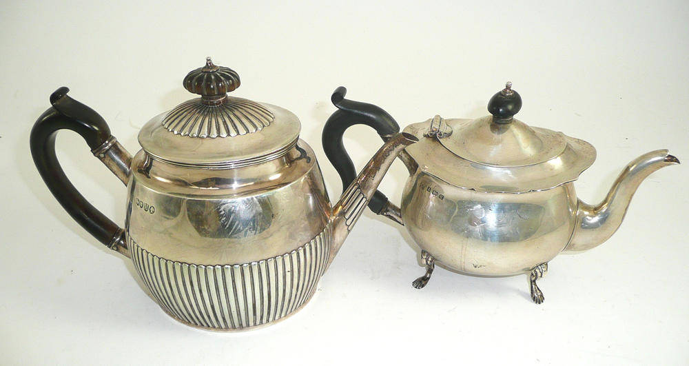 Lot 259 - A Victorian silver teapot with gadrooned body and a small silver teapot