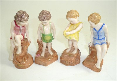 Lot 260 - Four Doulton children on the rock in colourways