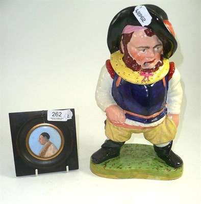 Lot 262 - A Staffordshire jar and cover as Falstaff and a framed miniature (2)