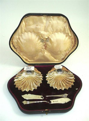 Lot 267 - Pair of cased silver shell butter dishes and knives