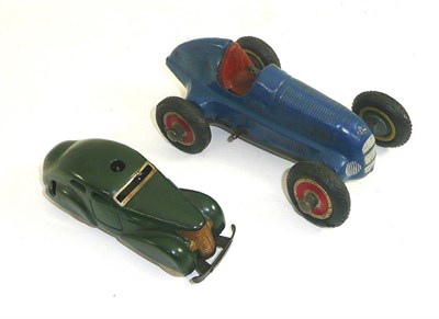 Lot 272 - Schuco studio 1050 blue painted clockwork car and a green Schuco patent 3000 car (2)