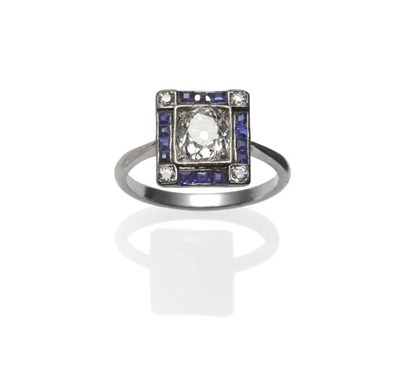 Lot 293 - An Art Deco Diamond and Sapphire Ring, an old cut diamond within a squared setting, to a border...