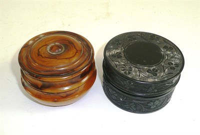 Lot 313 - Late 19th century ebonised circular box and cover and an olive wood circular box and cover (2)