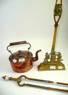 Lot 336 - A brass ";Nelson"; door stop, a copper kettle, a pair of brass coal tongs