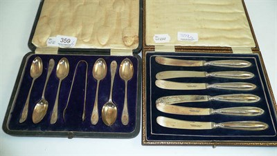 Lot 359 - A case of silver teaspoons and a case of silver handled knives