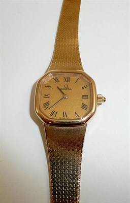 Lot 384 - A lady's 9ct gold wristwatch signed Omega and an Omega box