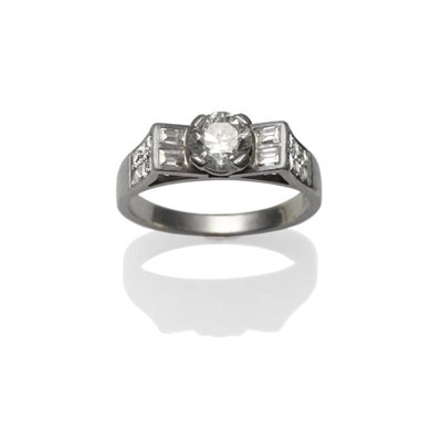 Lot 302 - An Art Deco Style Diamond Ring, a round brilliant cut diamond in a white four claw setting,...