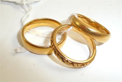 Lot 412 - Three 22ct gold band rings