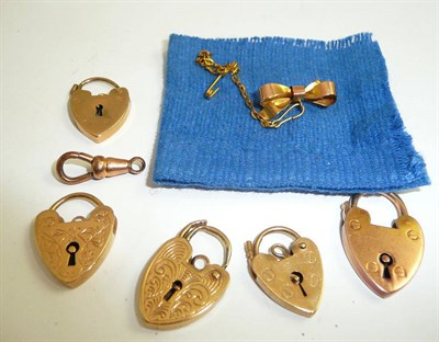 Lot 414 - Five locks, a swivel catch and a bow brooch