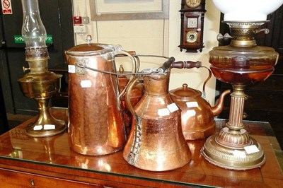 Lot 431 - Two oil lamps and four copper kettles/jugs