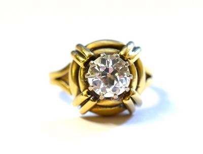 Lot 309 - A Diamond Solitaire Ring, the old cut diamond in a white claw setting, over a contemporary...