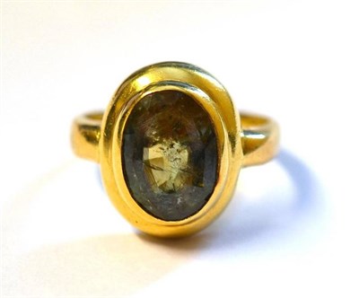 Lot 310 - An 18 Carat Gold Alexandrite Ring, the oval mixed cut stone in a rubbed over setting, to a...