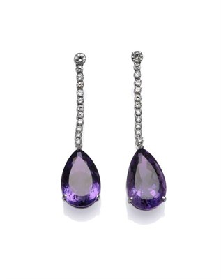 Lot 312 - A Pair of 18 Carat White Gold Amethyst and Diamond Drop Earrings, a row of round brilliant cut...