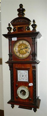 Lot 509 - A Vienna style wall clock with combination barometer and thermometer door