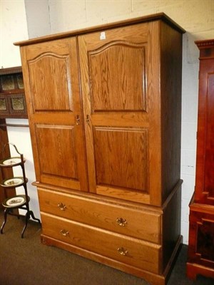 Lot 518 - A gentleman's oak double wardrobe by Royal Oak Company, Grassington