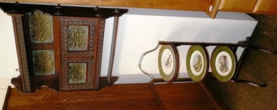 Lot 519 - Edwardian three tier cake stand with three plates, with a carved oak wall cabinet with brass...