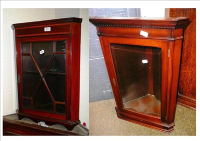 Lot 521 - A small Edwardian mahogany hanging corner cupboard and a reproduction corner cupboard