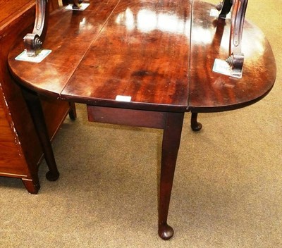 Lot 534 - George III mahogany pad foot table