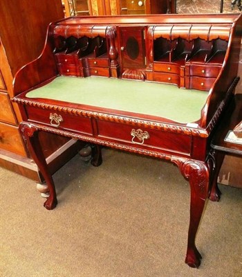 Lot 543 - A reproduction mahogany Chippendale style desk