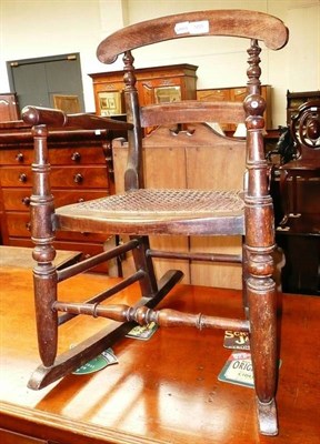 Lot 555 - A child's rocking chair