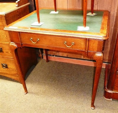 Lot 556 - A mahogany writing table